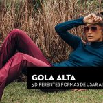 Mulher com gola alta e óculos de sol, sentada em gramado, com texto sobre formas de usar a peça neste inverno.