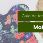 Guia de tamanhos: maiô com estampa floral em fundo escuro.